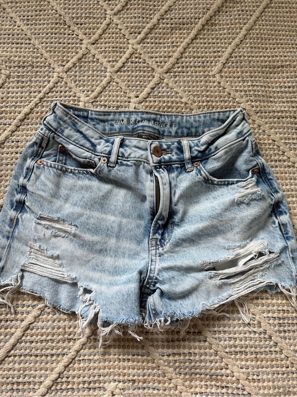 American Eagle Outfitters faded light blue distressed jean shorts